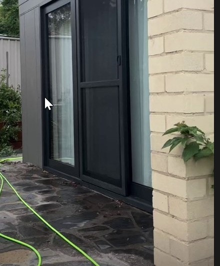 Sliding door glass cleaned, courtyard interior view